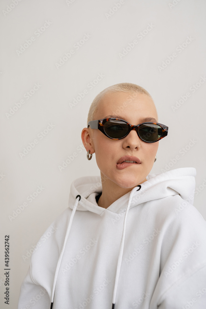 Portrait of Stylish sassy Girl with short haired in sunglasses Portrait of Stylish sassy Girl with short haired in sunglasses