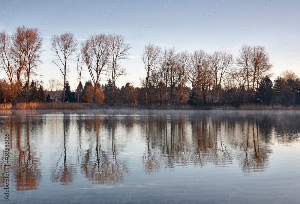 Dawn mist at sunrise. Lynford Lake, Norfolk, UK. Dawn mist at sunrise. Lynford Lake, Norfolk, UK.