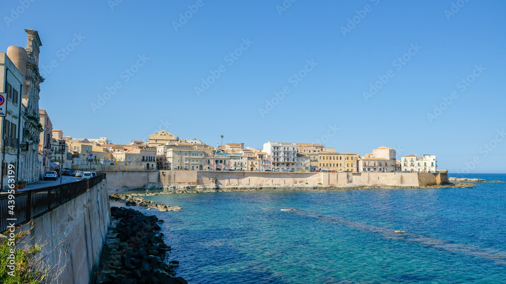 Ortigia island, Syracuse, Sicily. View of the beautiful seafront of the island, and Cala Rossa beach.