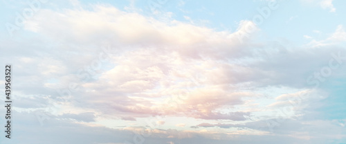 Panorama clean blue sky with cloud with orange light of the sun. Twilight sky and cloud at evening background image