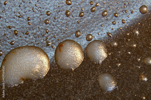 Grease droplets in bottom of pan, macro, abstract photo