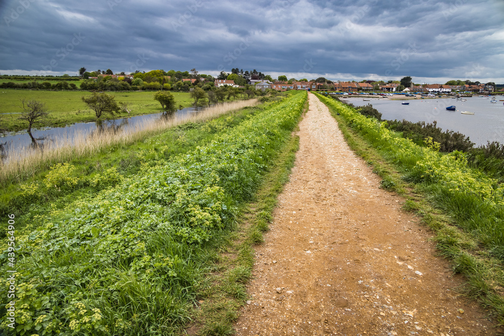 Path along the river in Burnham Overy Staithe, Norfolk, England