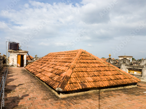 Triangular tiled roof on the terrace of an old heritage building in a village in Chettinad. photo