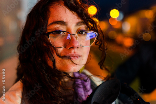 Beautiful smart woman with glasses on street