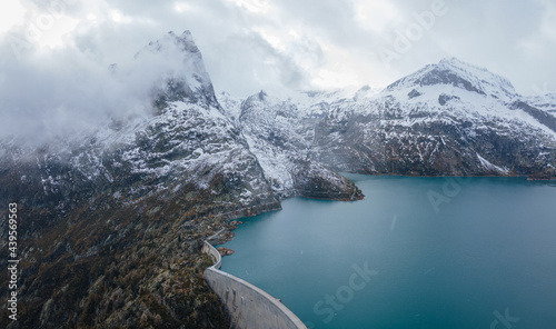 panorama of water dam in Alps mountains, aerial view