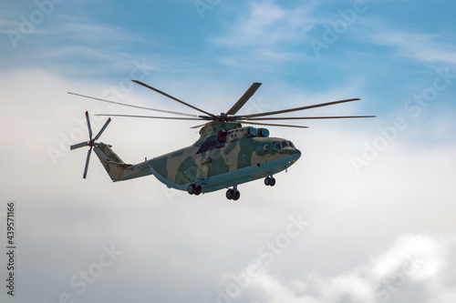 A russian heavy transport helicopter Mi-26 flying in the air