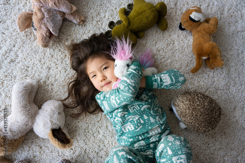 Little girl with stuffed toys photo