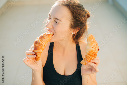 Woman eating pastry photo
