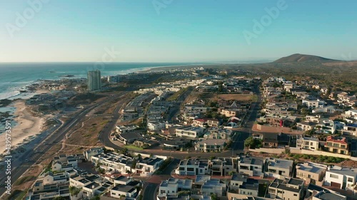 Flight over bigbay Beach, towards Cape Town, South Africa and Table Mountain. photo