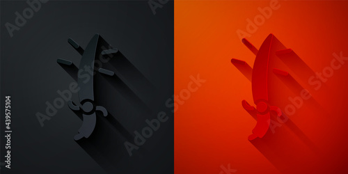 Paper cut Arabian saber icon isolated on black and red background. Paper art style. Vector