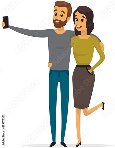 Young man and woman standing and making self portrait with mobile phone camera. Relationship and technology concept. Couple with phone is posing for joint photo. People take selfies together