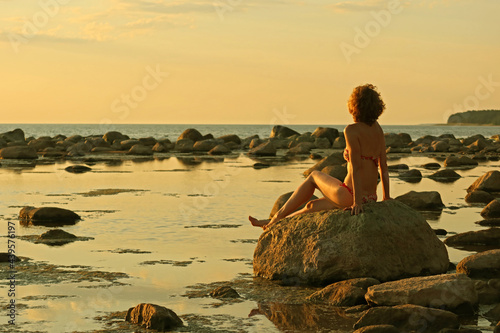 person sitting on the beach