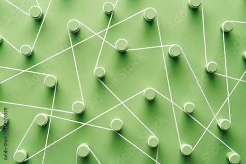 Green pegs connected with rope