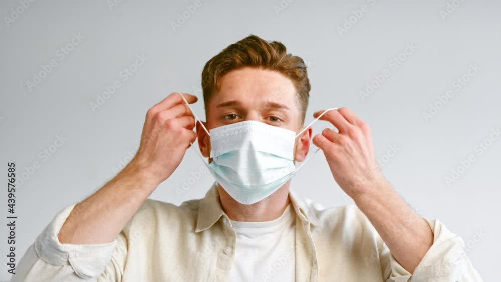 Bearded company manager takes off face mask breathing freely Bearded company manager takes off face mask breathing freely