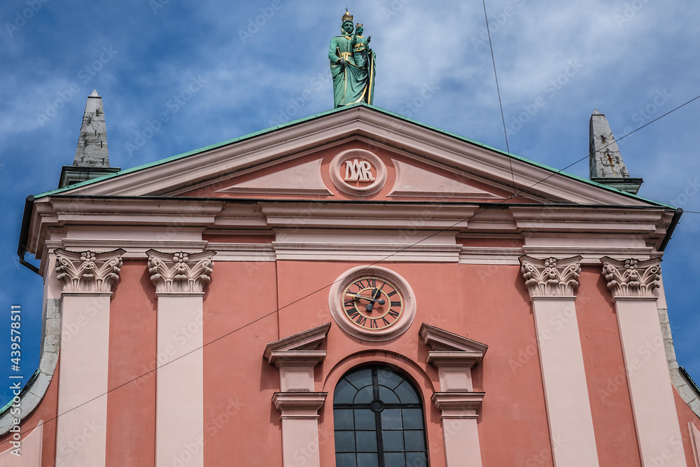 Franciscan Church of Annunciation (1646 - 1660) located on Preseren Square in Ljubljana - capital of Slovenia. Its red color is symbolic of the Franciscan monastic order. Franciscan Church of Annunciation (1646 - 1660) located on Preseren Square in Ljubljana - capital of Slovenia. Its red color is symbolic of the Franciscan monastic order.