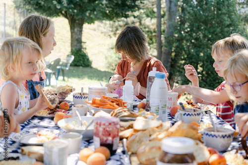little blonde girl eating  photo