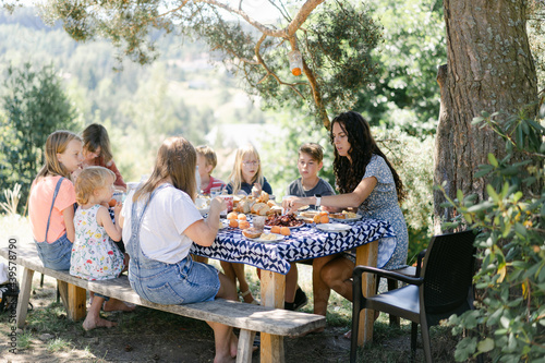 family enjoying a meal outdoors 