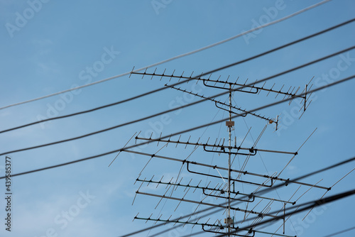 Image of old TV antenna and electric cable