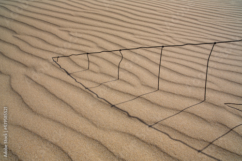 Fence in sand