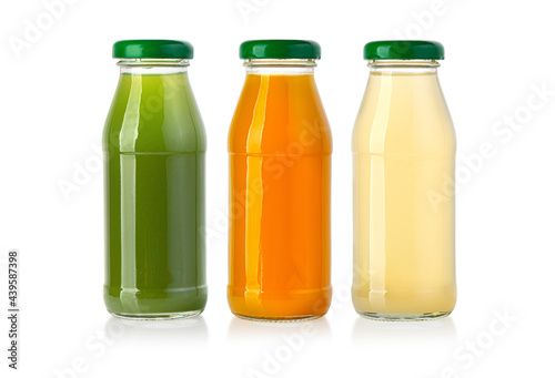 juice in glass bottle isolated on white