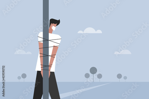 Conceptual illustration of a man tied to a pole at the time of covid -19 pandemic related social restrictions