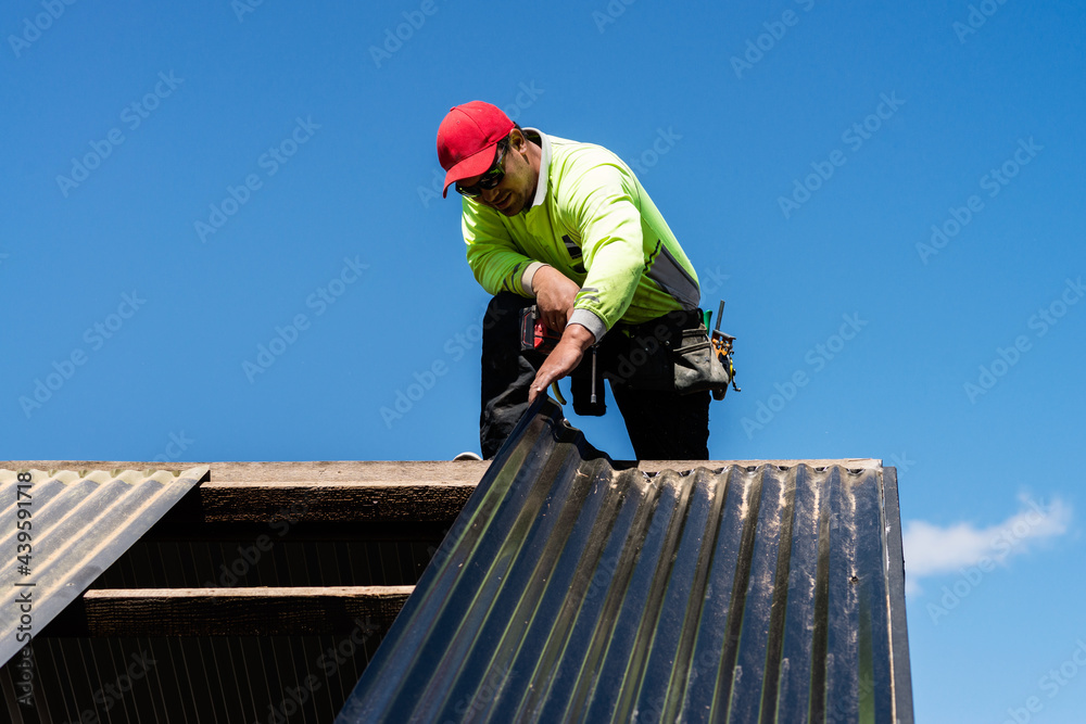 tradie working on a roof tradie working on a roof