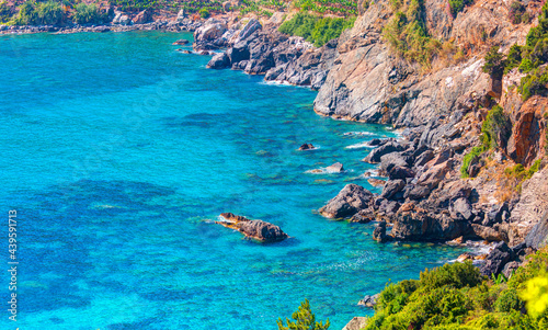 Turquoise sea waters in rocks near Antiocheia Ad Cragum ancient town - Alanya, Turkey 