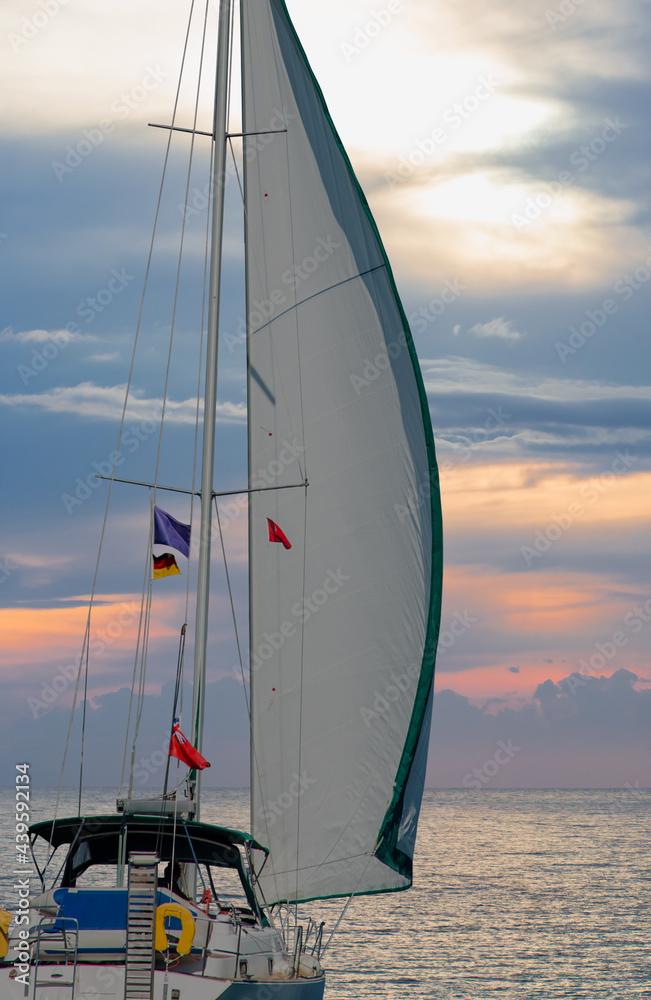 Fototapeta premium Sailing Yacht from sail regatta on mediterranean sea at sunset - Sailing luxury yacht with white sails in the Sea.