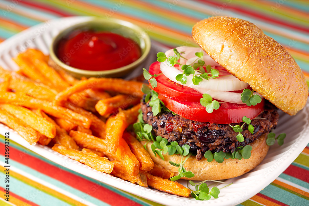 Plant based black bean burger with sweet potato fries Plant based black bean burger with sweet potato fries