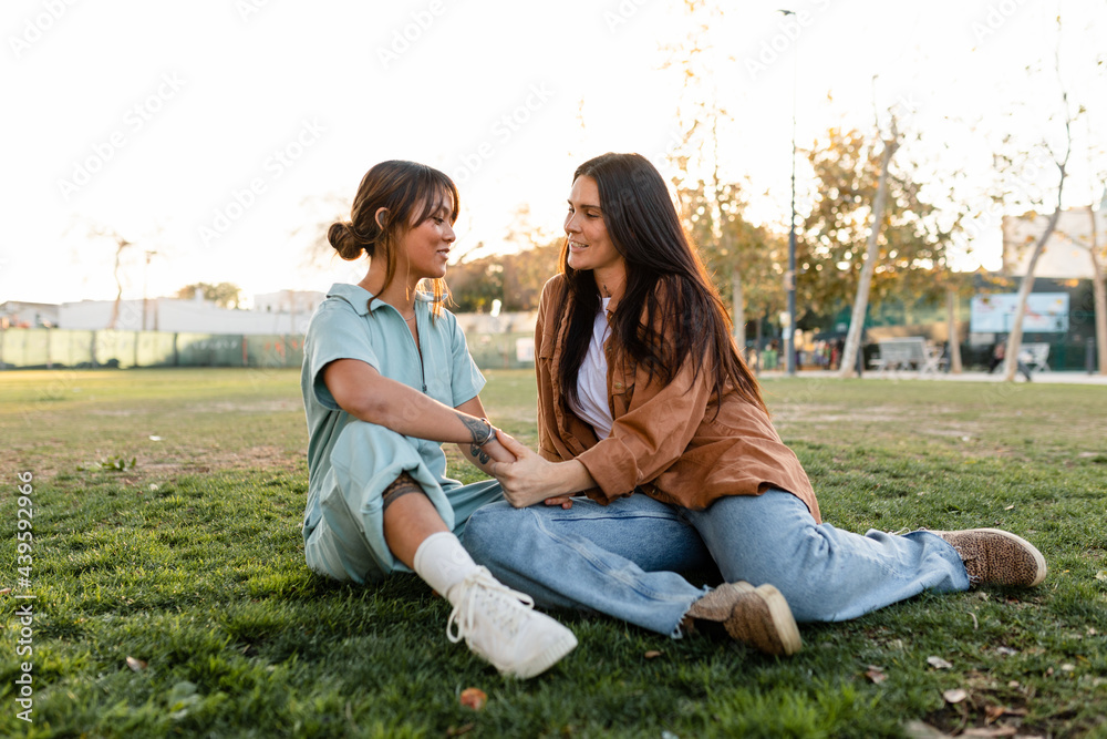Cute Lesbian Couple Women Talk About Their Future While Spending Time at the Park Cute Lesbian Couple Women Talk About Their Future While Spending Time at the Park