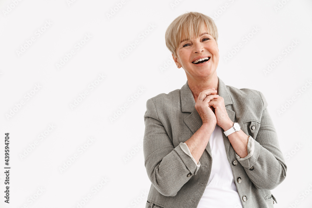 European mature woman laughing and looking at camera European mature woman laughing and looking at camera