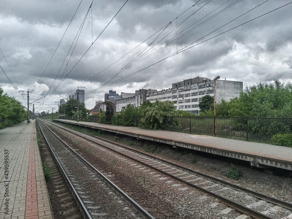 Fototapeta premium Empty railway platform in the old soviet industrial zone.