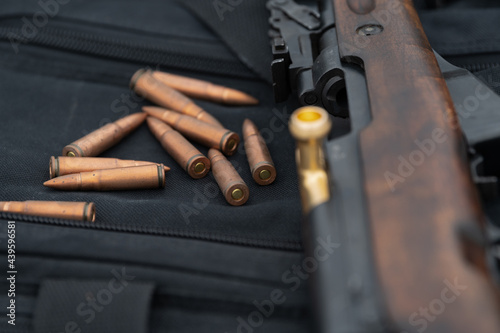 SKS Rifle with ammunition in focus photo