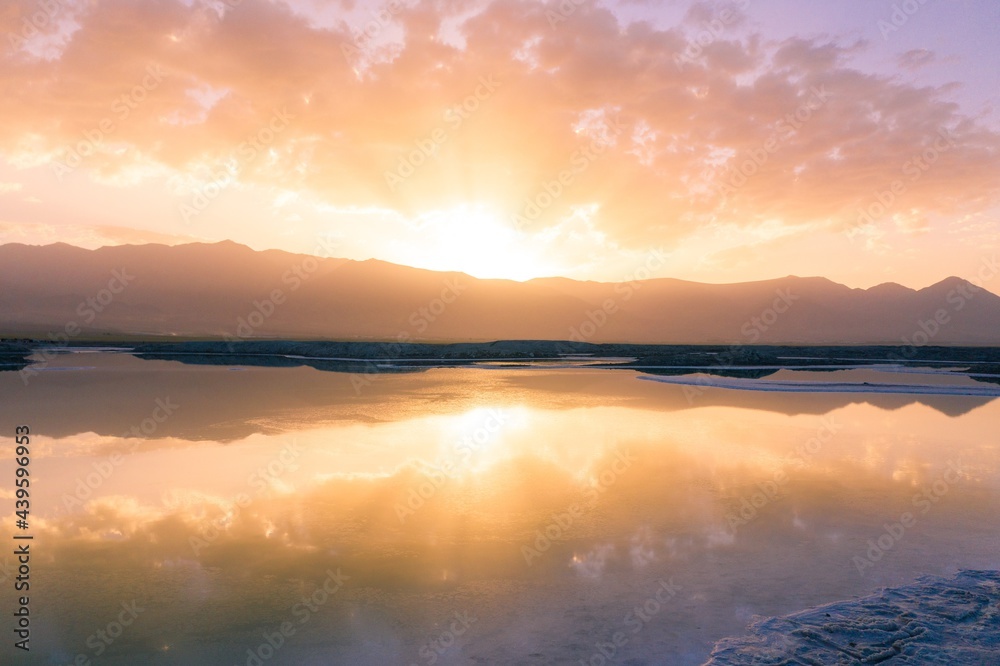 Fototapeta premium Beautiful sunrise over feicui lake in Qinghai province in China.