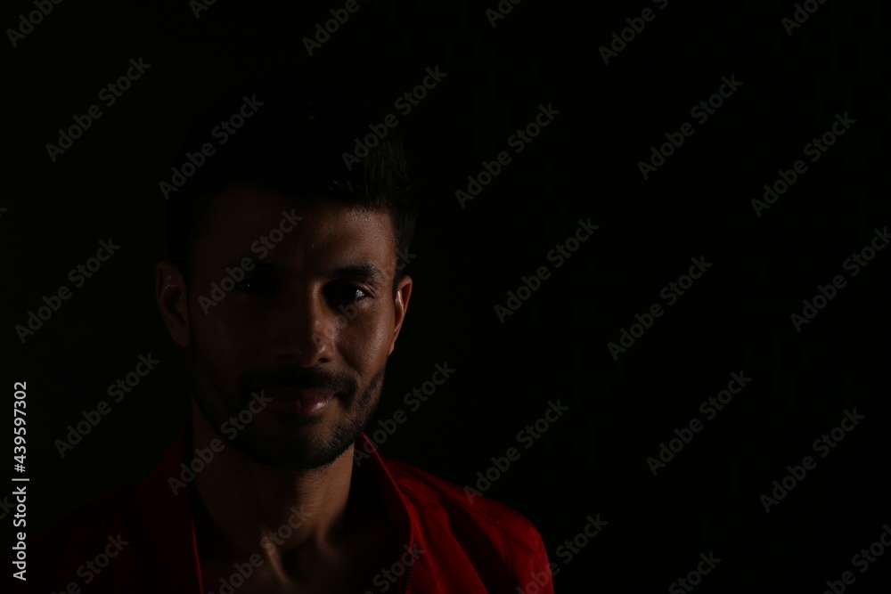 Portrait of a man in darkness