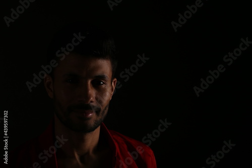 Portrait of a man in darkness