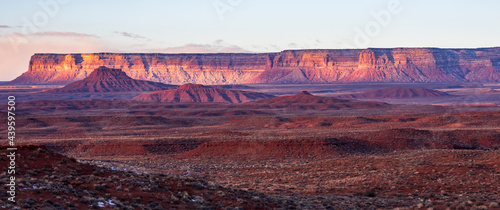 towering mesas and buttes illuminated by the morning light in Valley of the Gods in Utah.