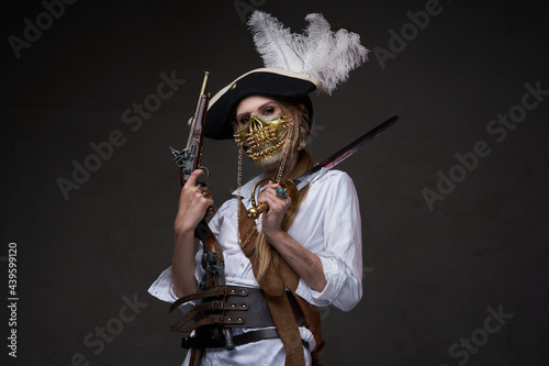 Female buccaneer with mask against dark background