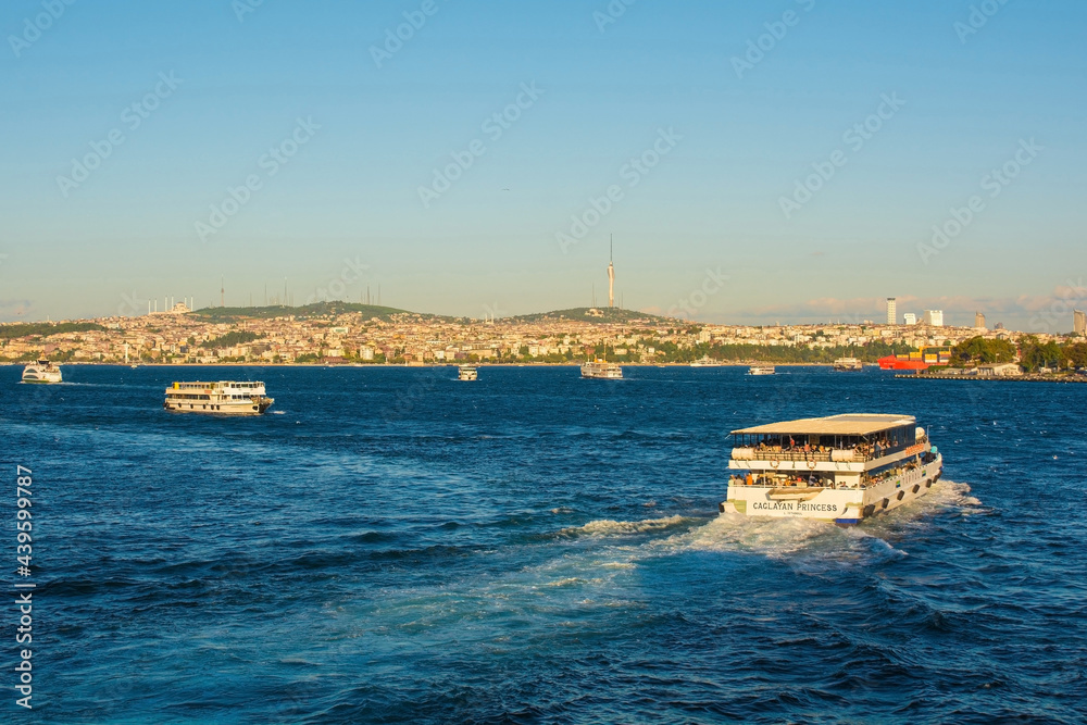 Istanbul, Turkey - September 6th 2019. Boats ferry commuters and tourists across the Bosporus between Eminonu and Uskudar