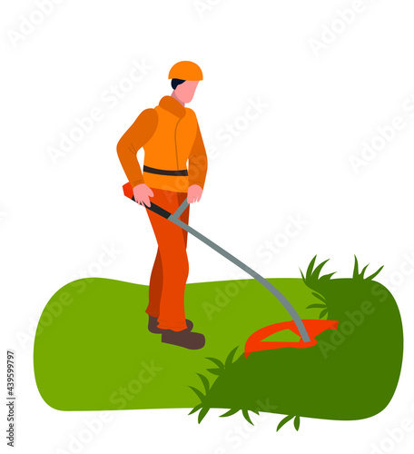 Gardener cuts grass on the lawn with the lawn mower