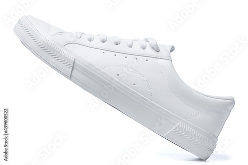 Trainers - white leather shoe on white background photo