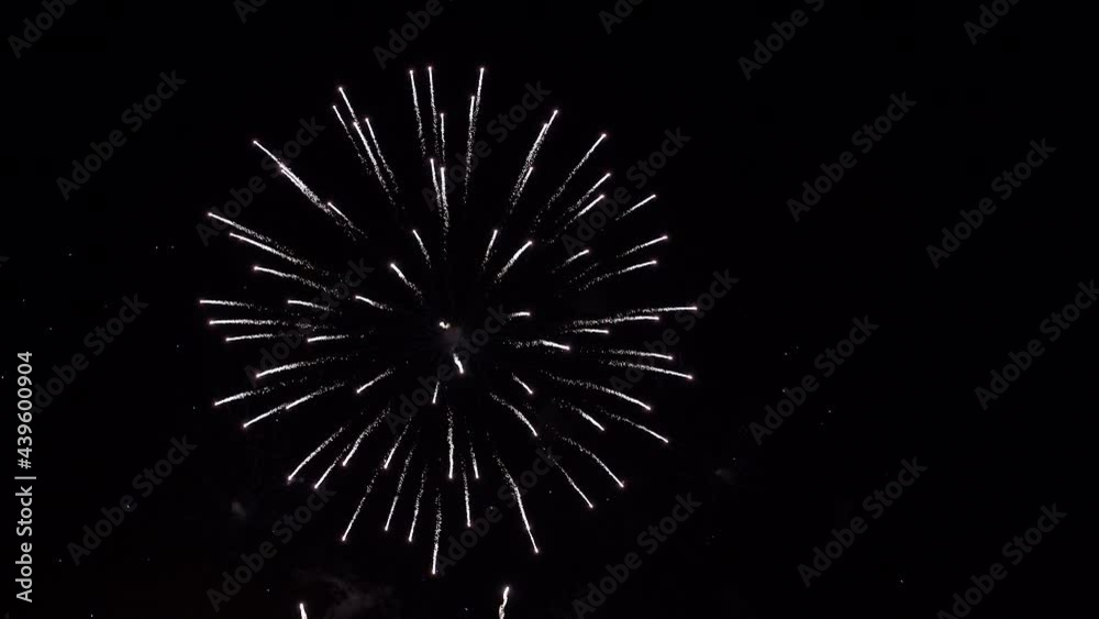 shining fireworks with bokeh lights in night sky. glowing fireworks show. New year's eve fireworks celebration. multico lored fireworks in night sky. beautiful colored night explosions in black sky shining fireworks with bokeh lights in night sky. glowing fireworks show. New year's eve fireworks celebration. multico lored fireworks in night sky. beautiful colored night explosions in black sky
