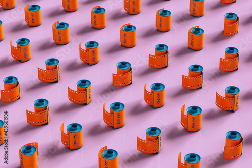 pattern of Orange film rolls on pink background