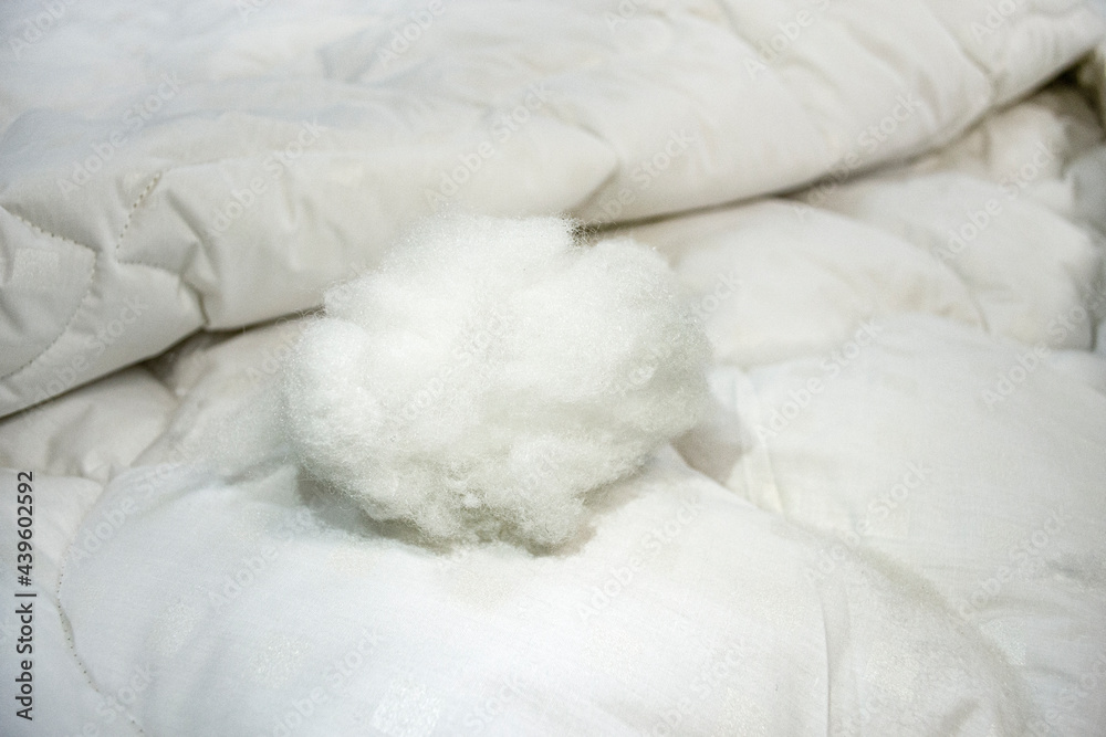 Obraz premium Modern fillers for the sewing and production of blankets, bedspreads and pillows. Natural white synthetic winterizer - hypoallergenic materials for the bedroom of children and adults.