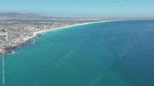 Aerial moving along the shoreline Cape Town, South Africa. CAPE TOWN, SOUTH AFRICA.