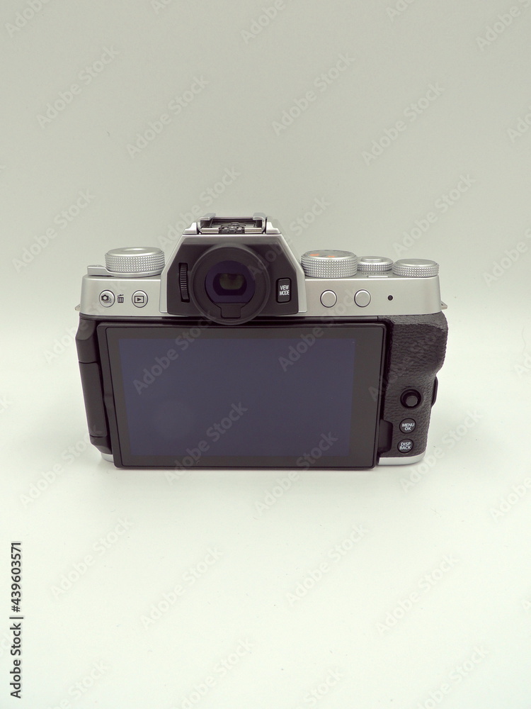 FUJIFILM X-T200 Mirrorless camera silver with black Fujifilm XC 15-45mm f3.5-5.6 OIS PZ lens. Macro. On a white background. New photographic equipment. FUJIFILM X-T200 Mirrorless camera silver with black Fujifilm XC 15-45mm f3.5-5.6 OIS PZ lens. Macro. On a white background. New photographic equipment.