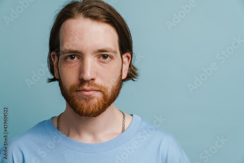 Young ginger man with beard posing and looking at camera © Drobot Dean