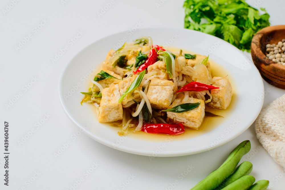 Indonesian stir fry bean sprouts mixed with fried tofu Indonesian stir fry bean sprouts mixed with fried tofu