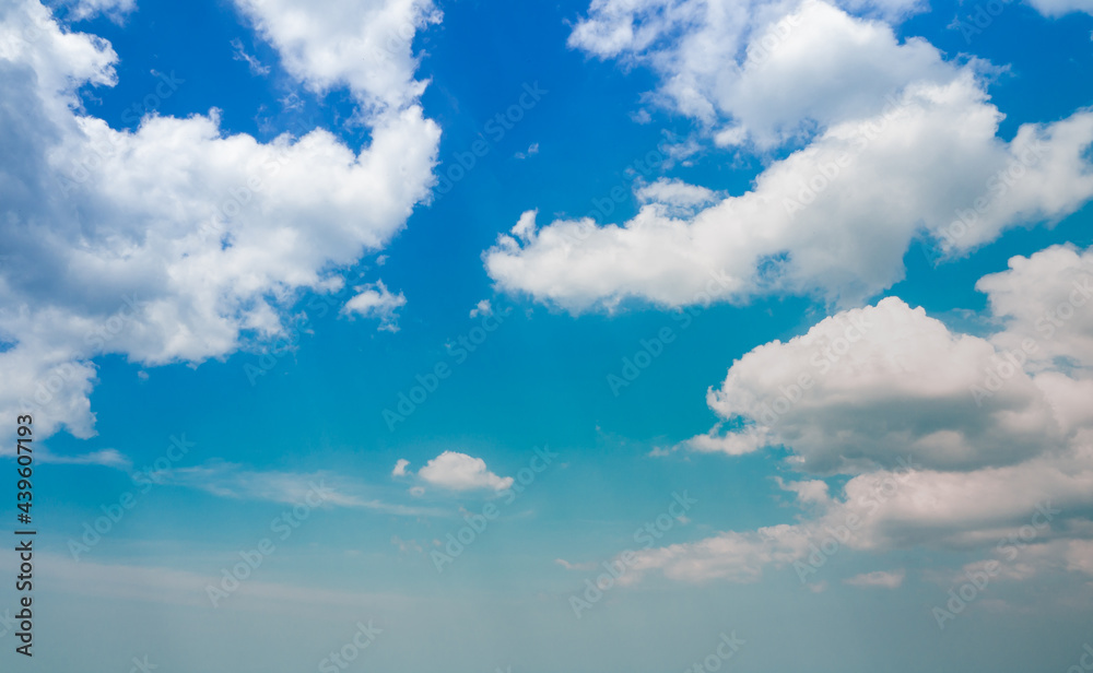 panoramic view pastel blue sky fluffy white clouds. bright sky good weather day.