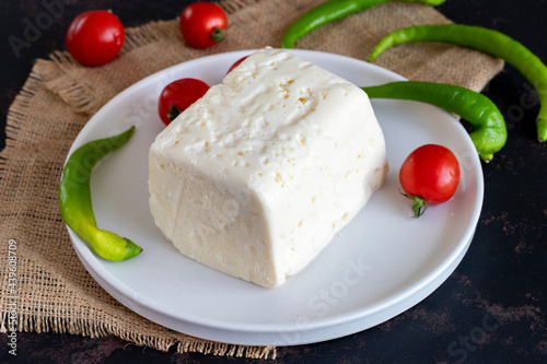 Feta cheese on dark background